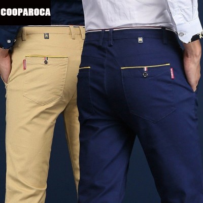 De nye menns forretnings casual bukser strekker hele kampen slank rett lang bomullsbukse ungdoms tidevann